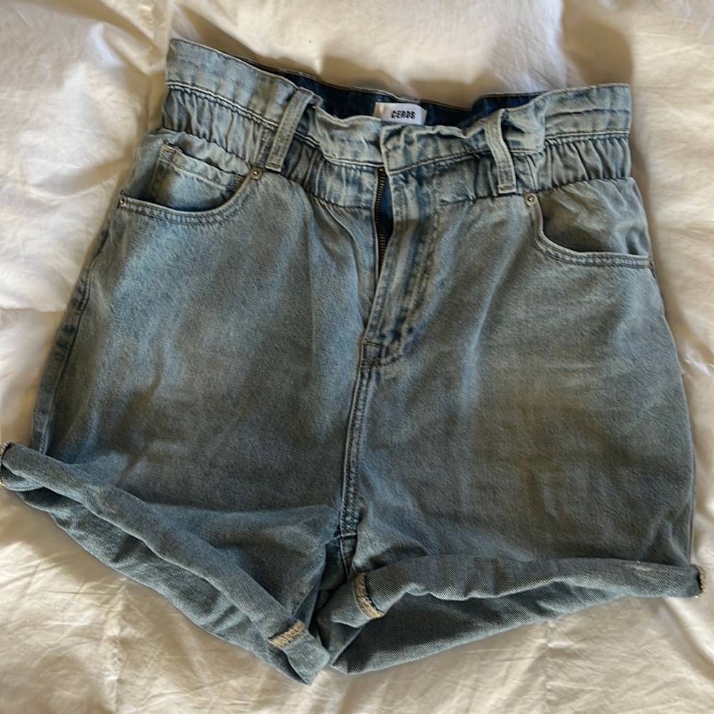 Women’s Jean shorts with draw string, pockets, extra length rolled.